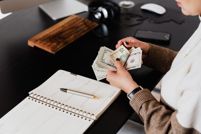 Professional accountant organizing tax documents and receipts for small business tax filing preparation